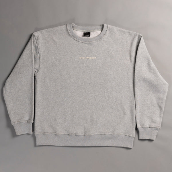 Gray sweatshirt with a brand logo on a gray background
