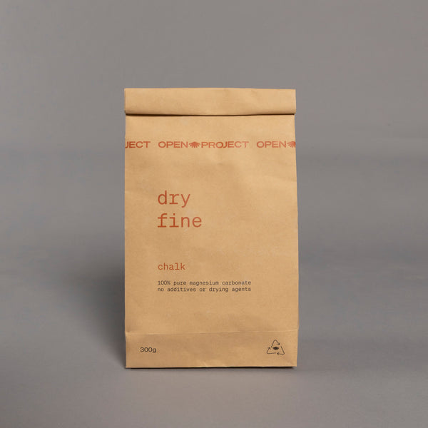 Brown bag of climbing chalk labelled 'dry fine'