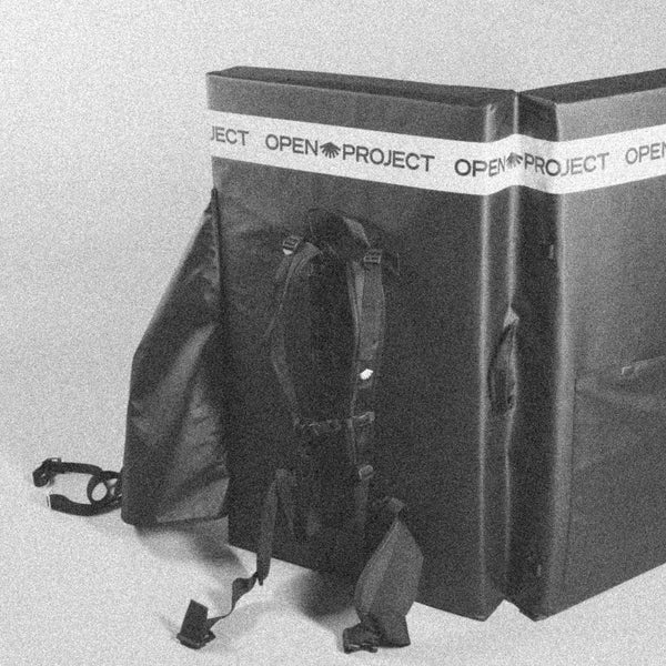 Climbing pad with 'Open Project' branding on a light gray background
