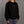 Woman wearing a black sweatshirt with 'OPEN PROJECT' text on a gray background
