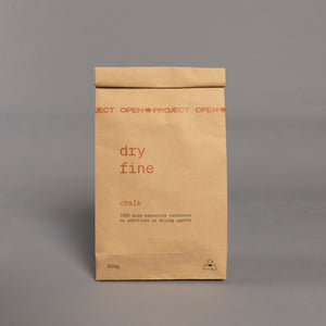 Brown bag of climbing chalk labelled 'dry fine'