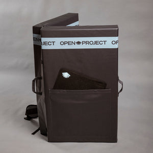 Black crash pad with 'Open Project' branding on a gray background