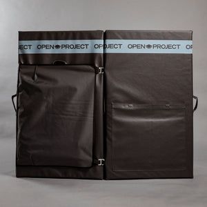 Black crash pad with 'Open Project' branding on a gray background
