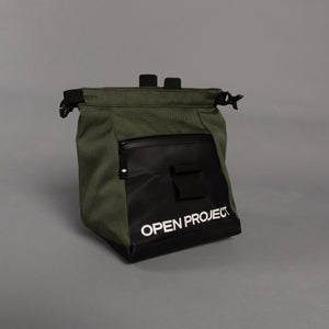Green boulder bag with black 'Open Project' logo on a gray background