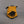 Yellow boulder bag with black design on a gray background