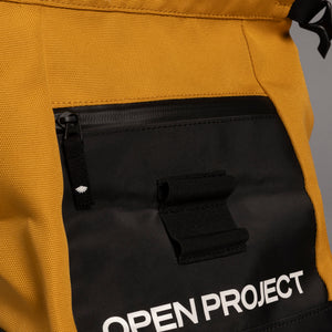Close-up of a yellow and black boulder bag with 'Open Project' branding.