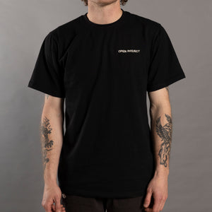 Person wearing a black t-shirt with 'Open Project' logo on a gray background