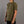 Person wearing a green t-shirt with a logo on a gray background