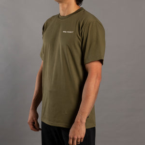 Person wearing a green t-shirt with a logo on a gray background