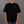Person wearing a black t-shirt with 'Open Project' logo on a gray background
