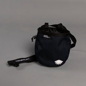 Navy chalk bag with 'Open Project' branding on a gray background