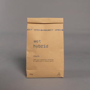 Brown bag of climbing chalk against grey backdrop